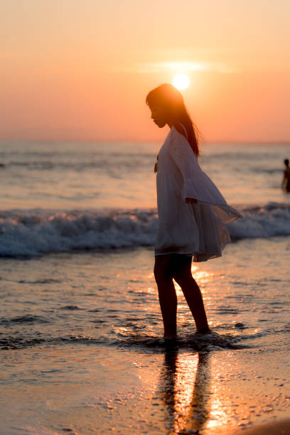 istock woman of the beach 875285958