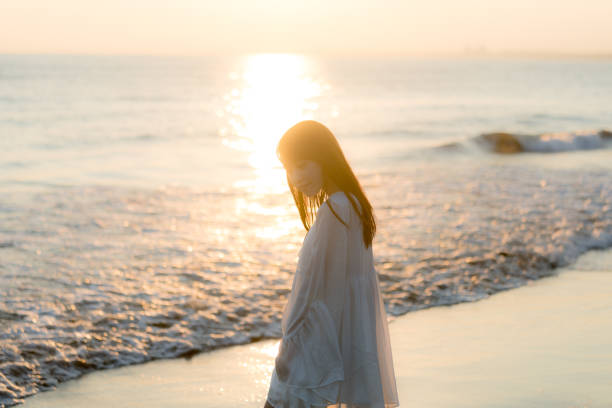 istock woman of the beach 875286094