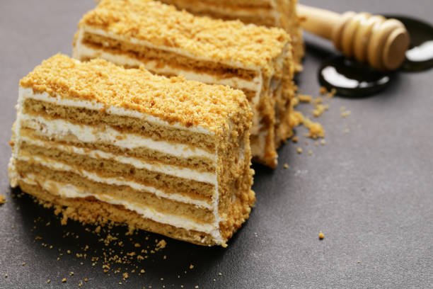istock honey cake with butter cream on a stone board 875286122