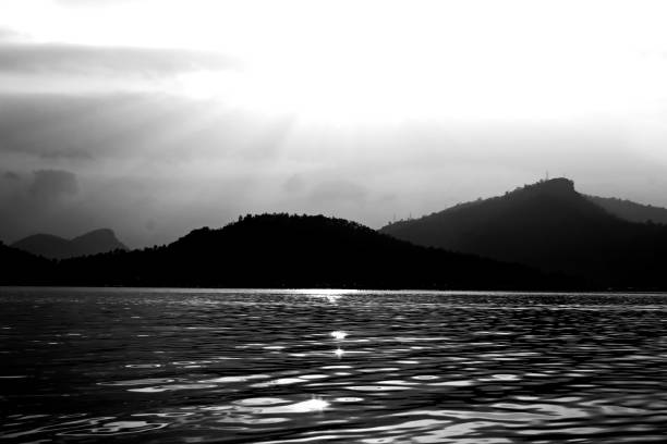 Beautiful mountain peak and river nature on black and white color shape for background.