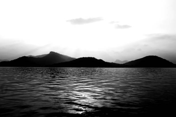 istock Beautiful mountain peak and river nature on black and white color shape for background. 875286916