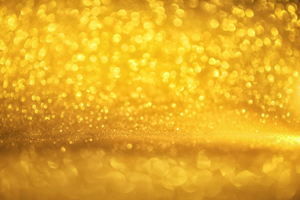 istock golden glitter texture Colorfull Blurred abstract background for birthday, anniversary, wedding, new year eve or Christmas. 875293526