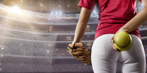 istock Softball female player on a professional arena 875297098