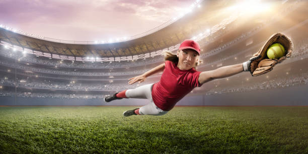 istock Softball female player on a professional arena 875297108
