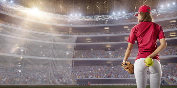 istock Softball female player on a professional arena 875297116