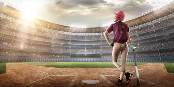 istock Softball female player on a professional arena 875297118