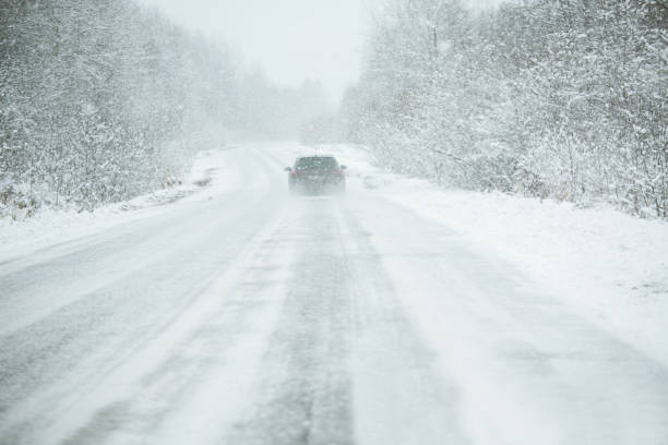 istock The car is driving on a winter road 875300282