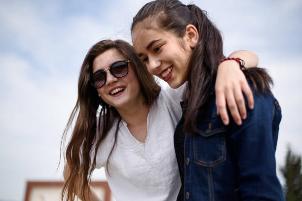 istock Two happy girl friends 875301472
