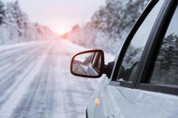 istock Winter road is reflected in the car's mirror 875301480
