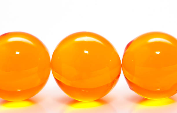 istock ball of fish oil on a white background. macro 875303840