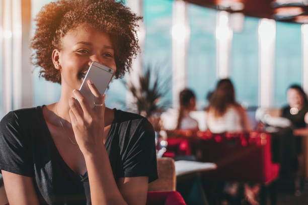 istock Girl using her smartphone to send audio message 875304324