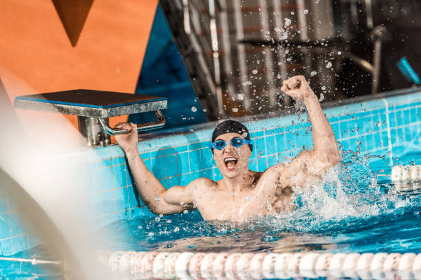 istock winner in competition swimming pool 875311136