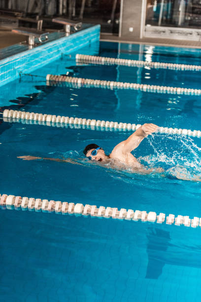 istock male professional swimmer 875311736