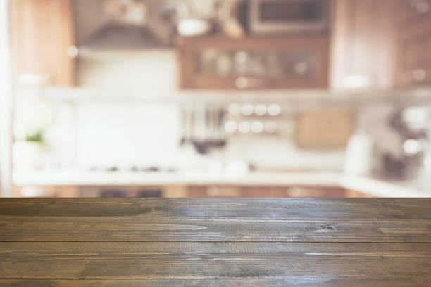 istock Blurred abstract background. Modern kitchen with tabletop and space for you. 875316042