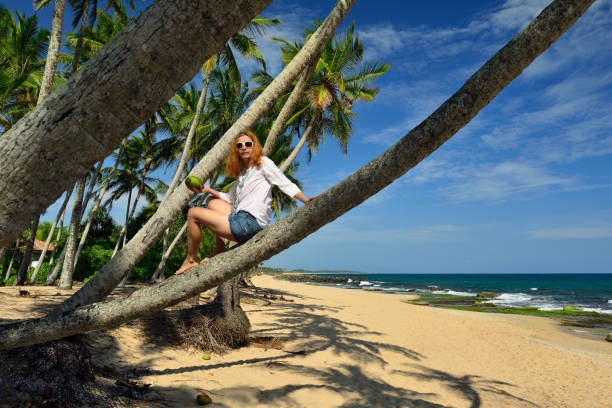 istock Carefree woman relaxing on tropical beach 875319192
