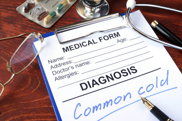 istock Medical form with diagnosis Common cold in a hospital. 875319360