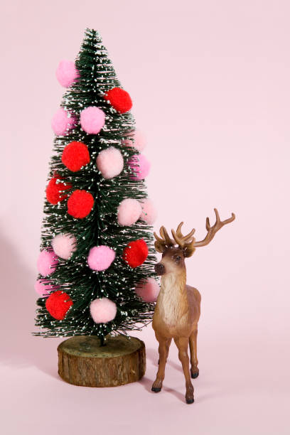 istock christmas tree pompoms and reindeer pink 875320086