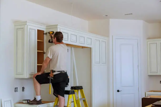 Photo of Installation of doors on kitchen cabinets