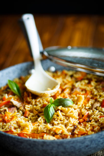 istock Pilaf with beef, carrots, onions, garlic, pepper and cumin. 875328688