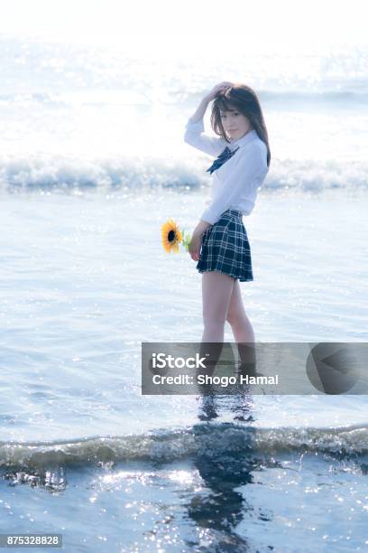 Schoolgirl On A Beach Stock Photo - Download Image Now - Adult, Adults Only, Beach