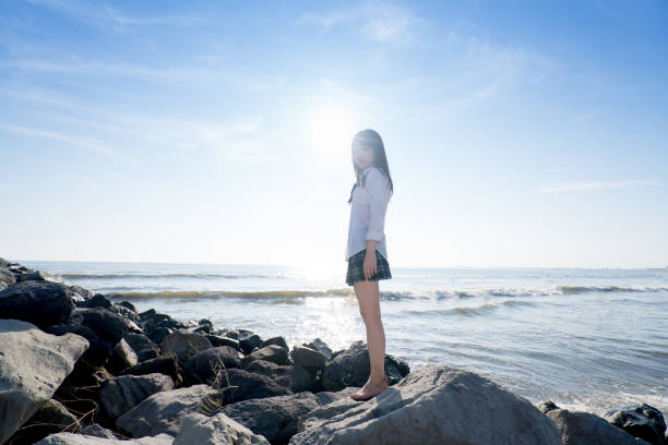 Female senior high school student on a beach