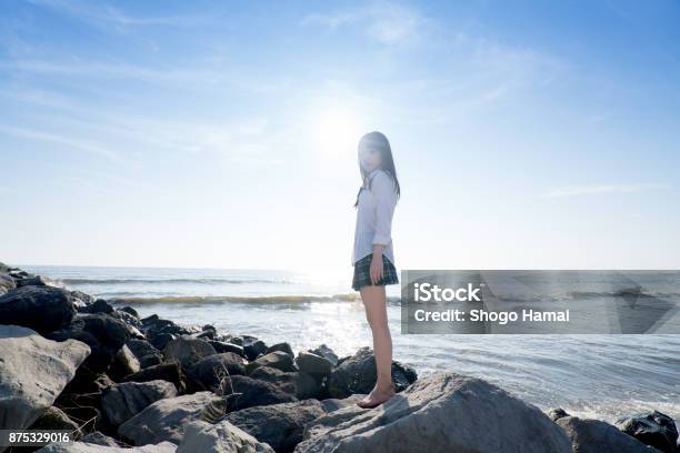 Schoolgirl On A Beach Stock Photo - Download Image Now - Female High School Student, Japan, Beach