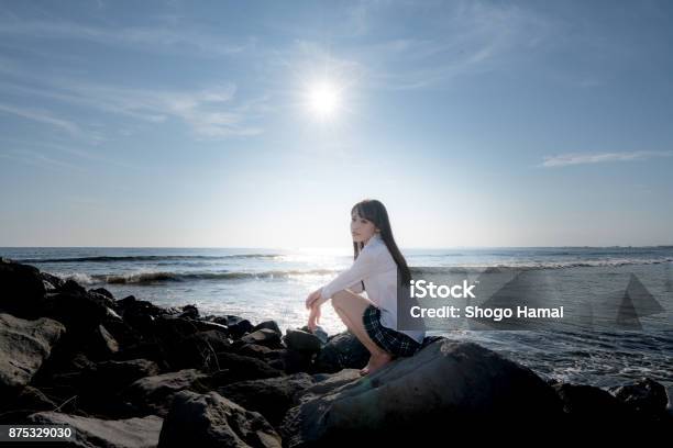 Schoolgirl On A Beach Stock Photo - Download Image Now - Adult, Adults Only, Beach