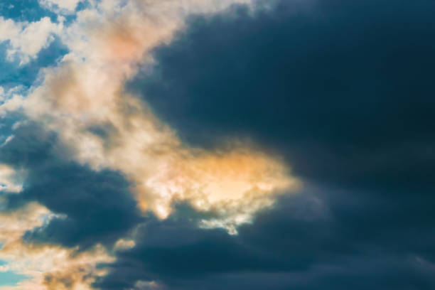 istock Abstract background, dark clouds in the sky after a storm with glimpses 875331496