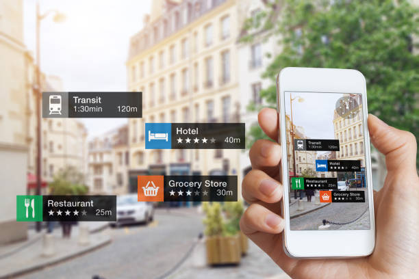 Augmented Reality information technology, hand, smartphone screen, street business, services Augmented Reality (AR) information technology about nearby businesses and services on smartphone screen guide customer or tourist in the city, close-up of hand holding mobile phone, blurred street travel hotel accommodations stock pictures, royalty-free photos & images