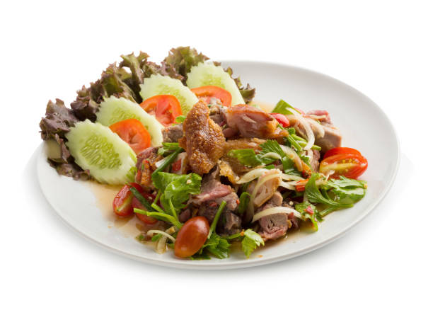 istock Roasted pork belly spicy salad isolated on white back ground 875335808