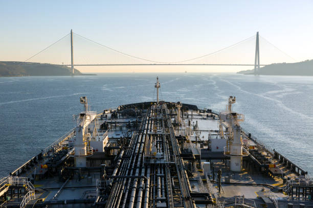 istock Tanker Ship is steering under the bridge. 875342642