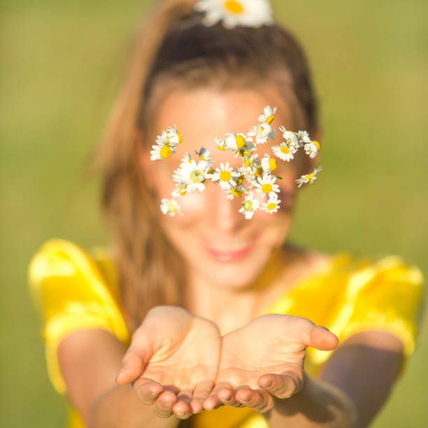 istock Woman with camomile flowers 875353676