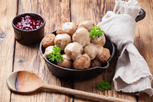 istock Traditional meatballs with sauce in a cast iron skillet 875356280