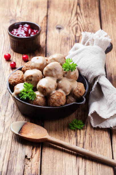 istock Traditional meatballs with sauce in a cast iron skillet 875358426