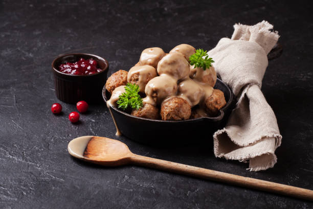 istock Traditional meatballs with sauce in a cast iron skillet 875358558