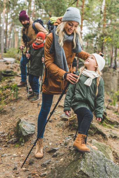 istock family walking in autumn forest 875363200