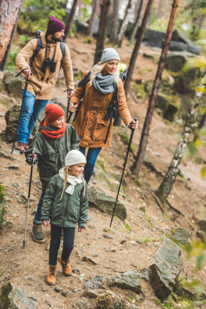 istock family walking in autumn forest 875363396
