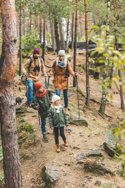 istock family walking in autumn forest 875363514