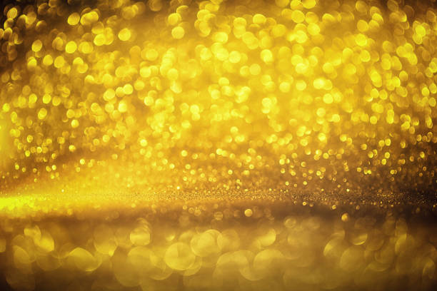istock golden glitter texture Colorfull Blurred abstract background for birthday, anniversary, wedding, new year eve or Christmas. 875363614