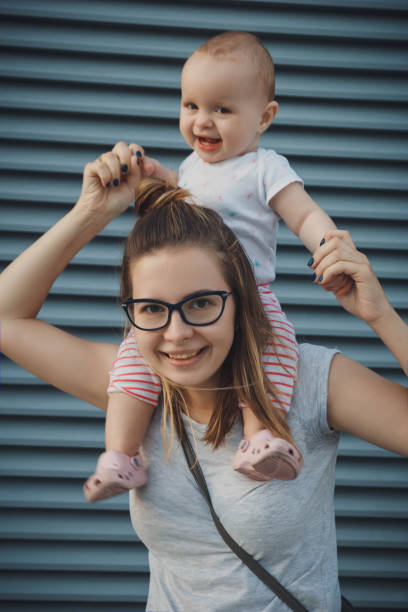 istock Young mother with baby girl 875363652