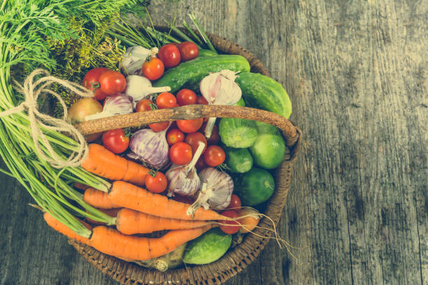 istock Assorted vegetables, organic food on wooden farm table, overhead 875363844