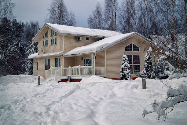 istock Countryside house heavily covered with snow in january 875370200