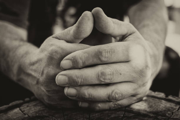istock Man hands playing acoustic guitar, close up 875373602