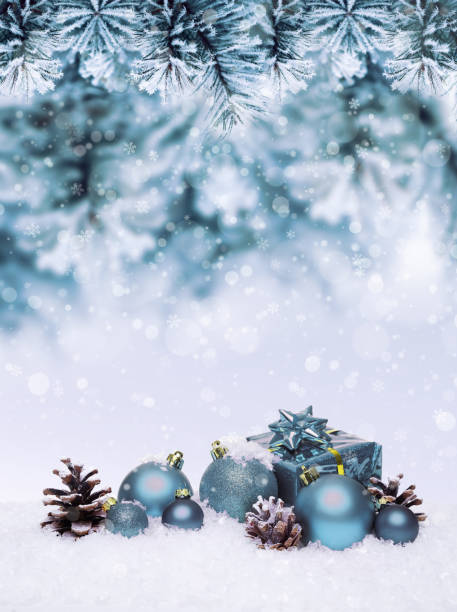 istock Christmas blue background with balls hanging on pine tree. 875375918