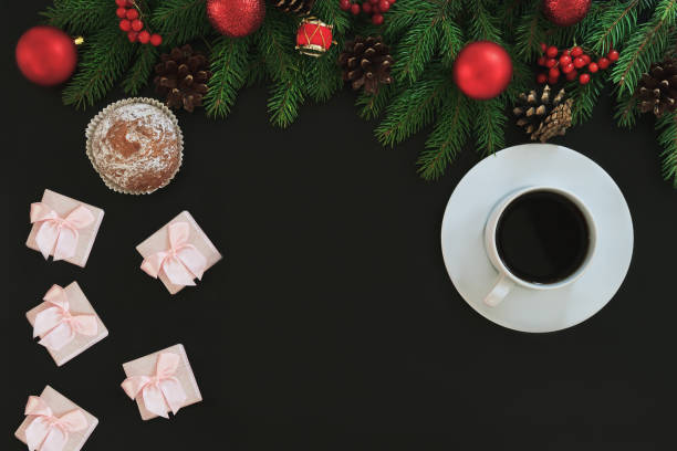 istock Christmas background or Xmas card with decorations food, ormament, cup of coffee, gift present. Creating present list for winter holidays.  Festive breakfast. Top view and black backtop 875384036