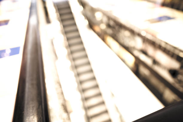 istock Escalator in the shopping mall 875388154