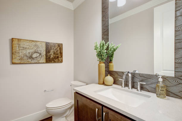 istock White bathroom interior with vanity cabinet and a toilet 875388238