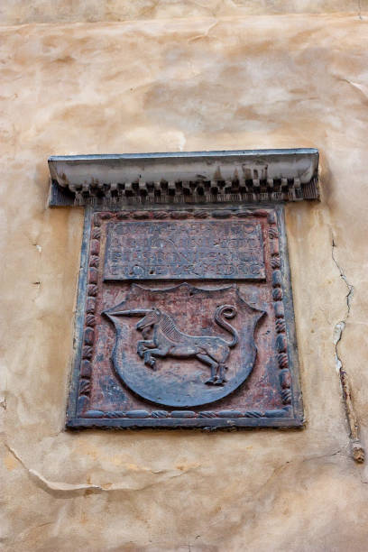 istock Close up unicorn emblem on wall in Warsaw 875390998