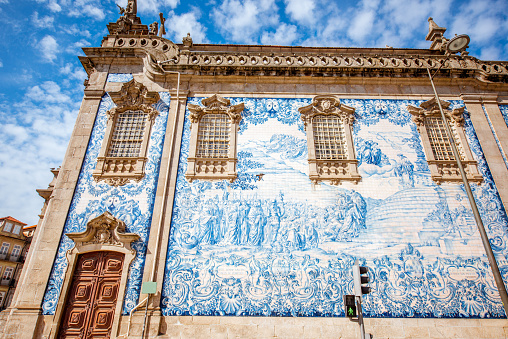 Facade view on the church wall with famous poruguese blue tiles Azulejo in Porto city in Portugal
