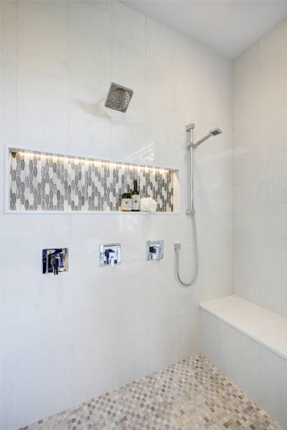 istock Stunning walk-in shower with white tile surround. 875394588